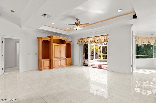 unfurnished living room with visible vents, a raised ceiling, ceiling fan, and crown molding