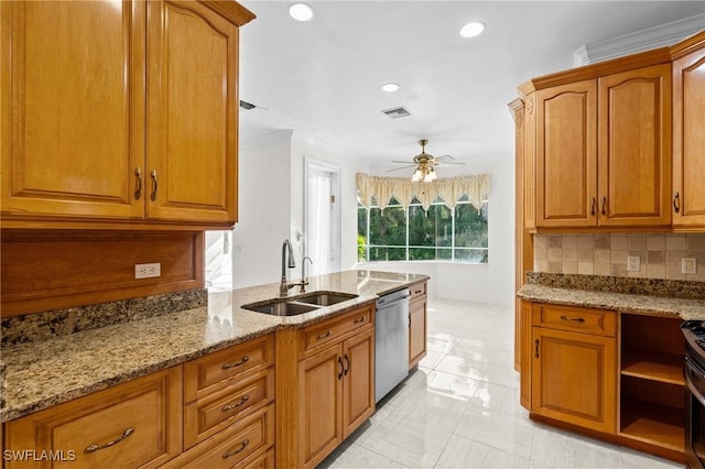 kitchen featuring brown cabinetry, light stone countertops, stainless steel appliances, and a sink