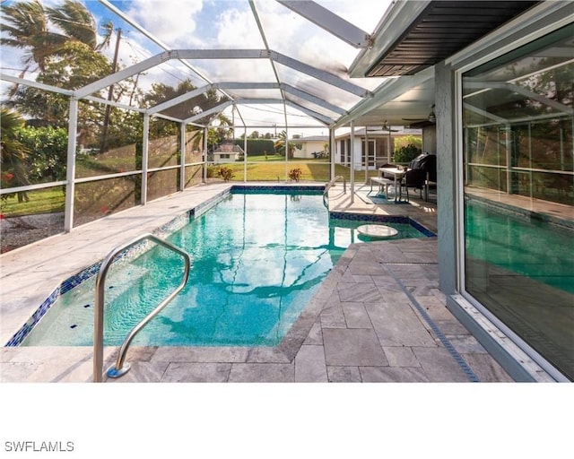 outdoor pool with a patio area