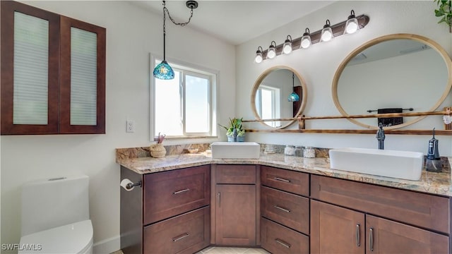 bathroom featuring toilet and vanity