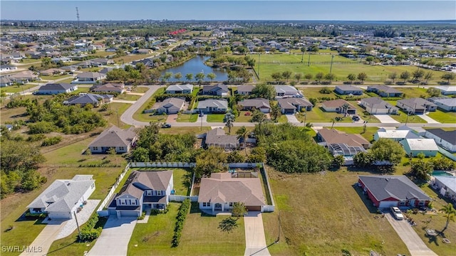 aerial view featuring a residential view and a water view