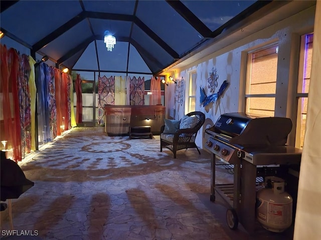 view of patio with glass enclosure and a hot tub