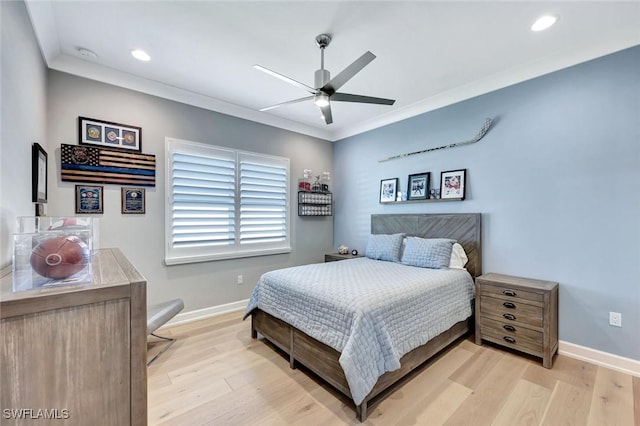 bedroom with light wood-style flooring, crown molding, baseboards, and ceiling fan