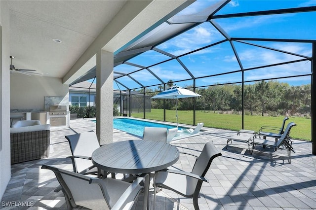 view of patio with area for grilling, glass enclosure, an outdoor pool, and a ceiling fan