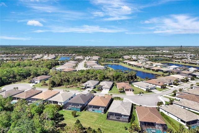 bird's eye view with a residential view and a water view