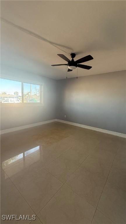 2510 SE 16th Pl Unit 103, Cape Coral, FL 33904 - spare room with tile patterned flooring, baseboards, and a ceiling fan