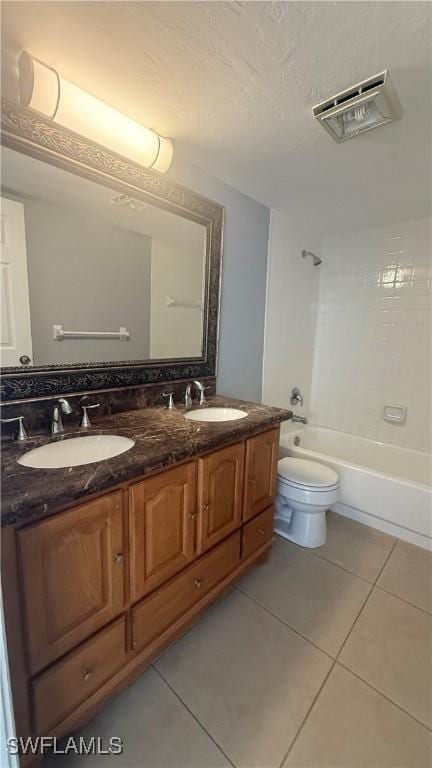 2510 SE 16th Pl Unit 103, Cape Coral, FL 33904 - full bathroom featuring tile patterned flooring, double vanity, toilet, shower / washtub combination, and a textured ceiling