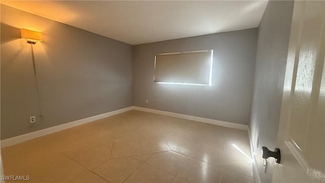 2510 SE 16th Pl Unit 103, Cape Coral, FL 33904 - empty room with baseboards and light tile patterned floors
