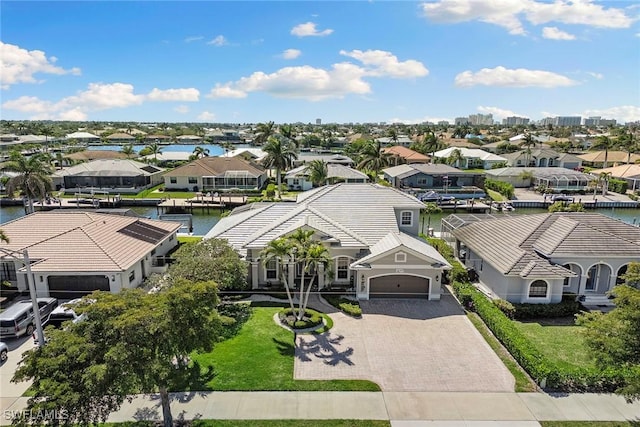 aerial view featuring a residential view and a water view