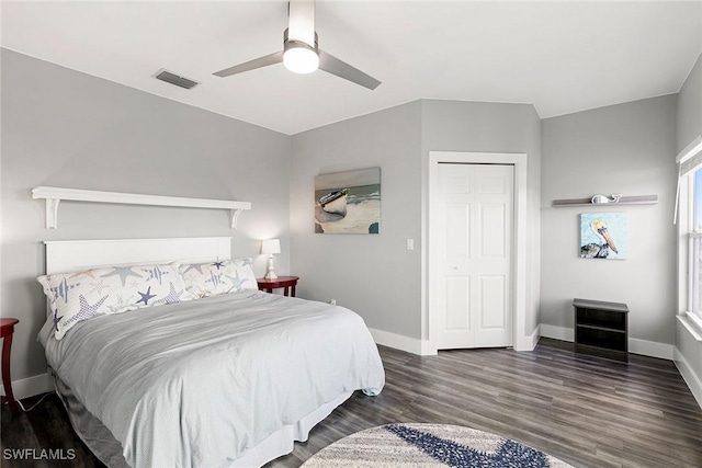 bedroom featuring ceiling fan, wood finished floors, visible vents, and baseboards