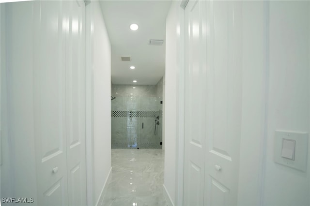 corridor with recessed lighting, visible vents, baseboards, and marble finish floor