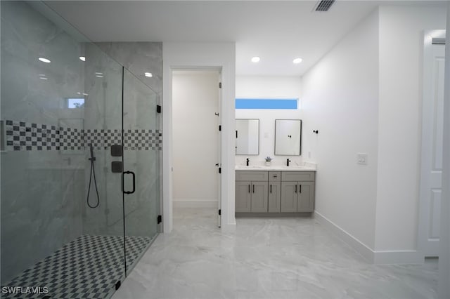 full bath with visible vents, marble finish floor, a marble finish shower, and a sink