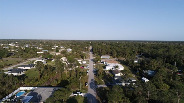 drone / aerial view featuring a view of trees