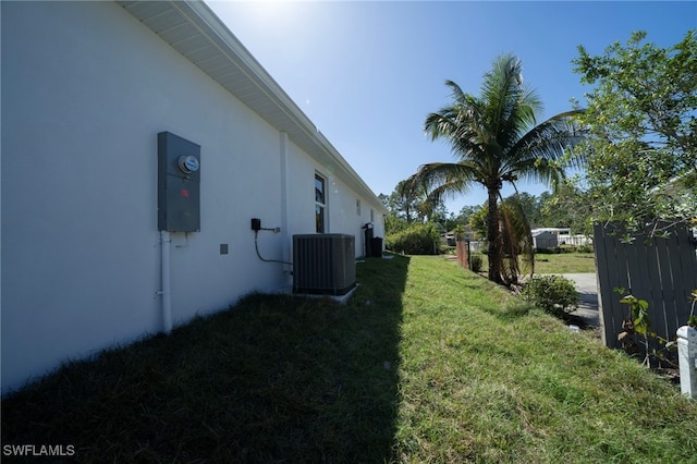 view of yard with central AC