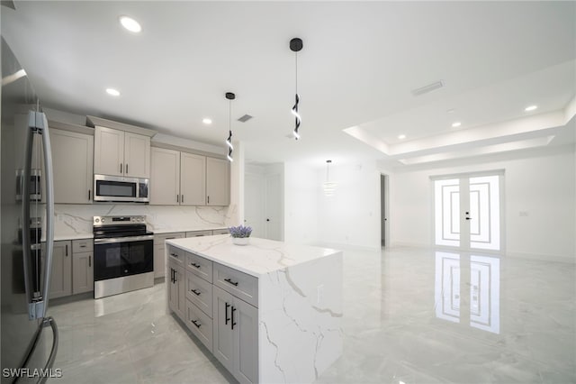 kitchen with a kitchen island, recessed lighting, gray cabinets, marble finish floor, and stainless steel appliances