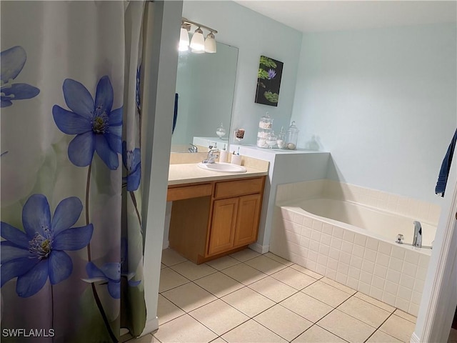 bathroom with tile patterned floors, vanity, and a bath