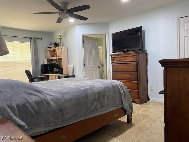 bedroom featuring light tile patterned floors, baseboards, and ceiling fan