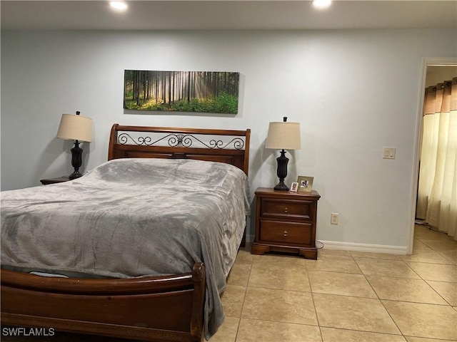 tiled bedroom featuring recessed lighting and baseboards