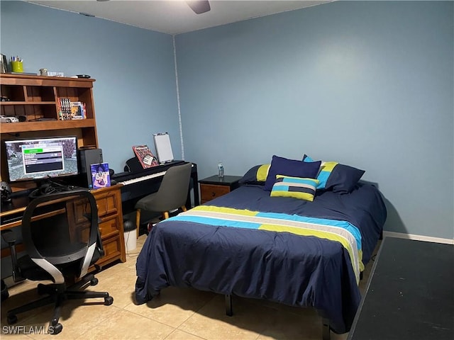 tiled bedroom with a ceiling fan