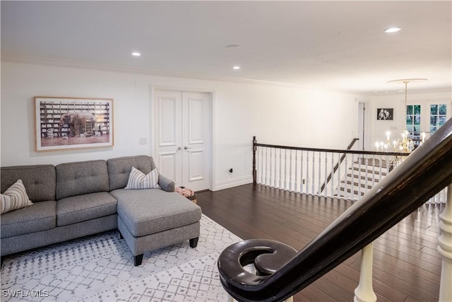 13189 Valewood Dr, Naples, FL 34119 - living area with a chandelier, wood finished floors, recessed lighting, and ornamental molding