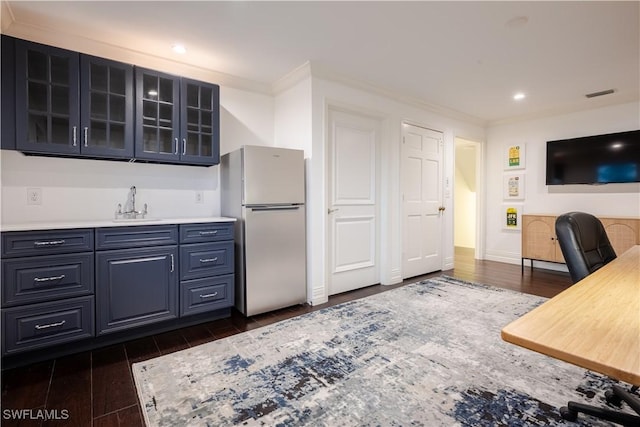13189 Valewood Dr, Naples, FL 34119 - kitchen with freestanding refrigerator, dark wood-style floors, glass insert cabinets, light countertops, and recessed lighting