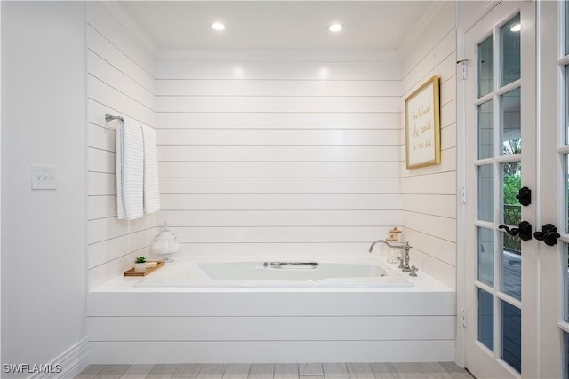13189 Valewood Dr, Naples, FL 34119 - bathroom featuring a bath and crown molding