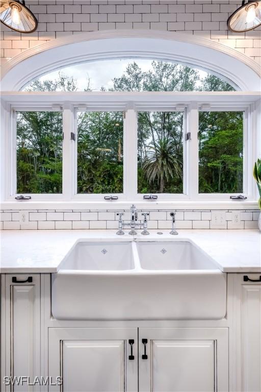 13189 Valewood Dr, Naples, FL 34119 - kitchen view of light countertops and white cabinetry