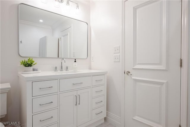 13189 Valewood Dr, Naples, FL 34119 - bathroom with vanity and ornamental molding