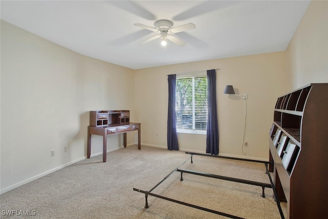 bedroom featuring ceiling fan, baseboards, and carpet