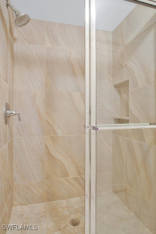 bathroom with a stall shower