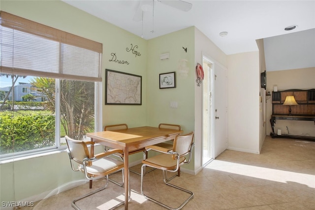 dining room featuring baseboards and ceiling fan