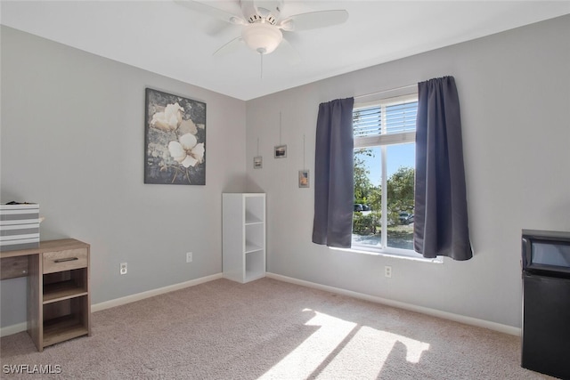 unfurnished bedroom with baseboards, multiple windows, and carpet flooring