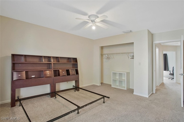 bedroom with visible vents, baseboards, carpet, a closet, and a ceiling fan