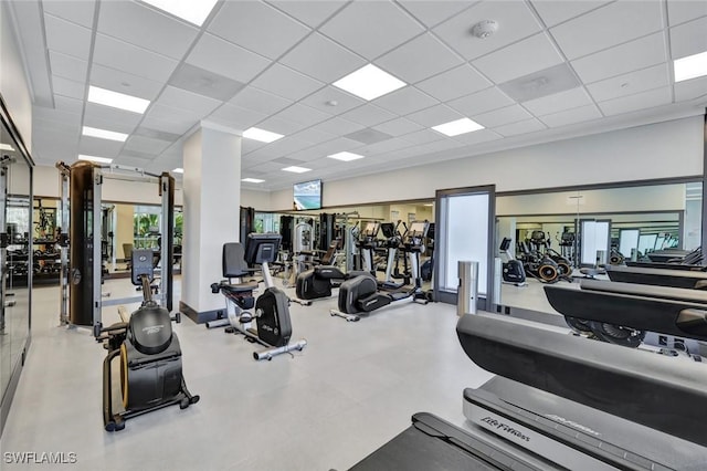 exercise room featuring a drop ceiling