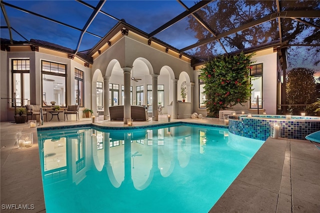 view of pool featuring a pool with connected hot tub and a patio area