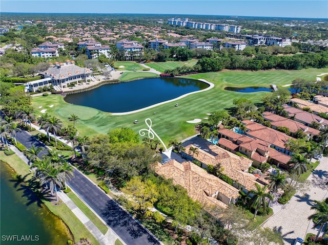 bird's eye view with view of golf course and a water view