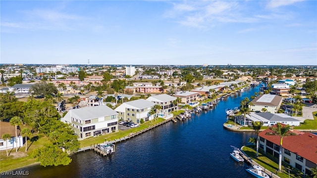 drone / aerial view with a residential view and a water view