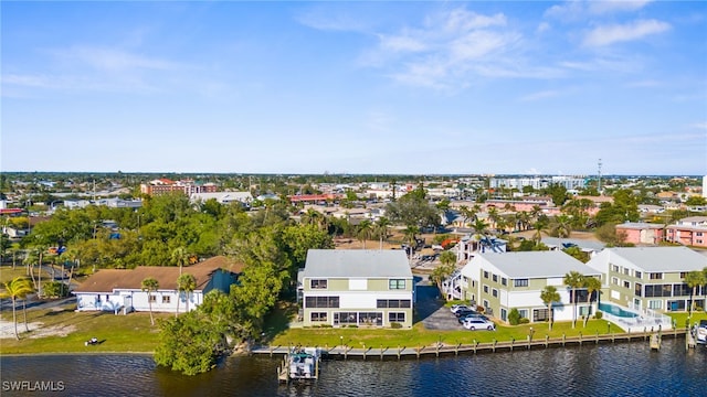 bird's eye view featuring a water view and a residential view