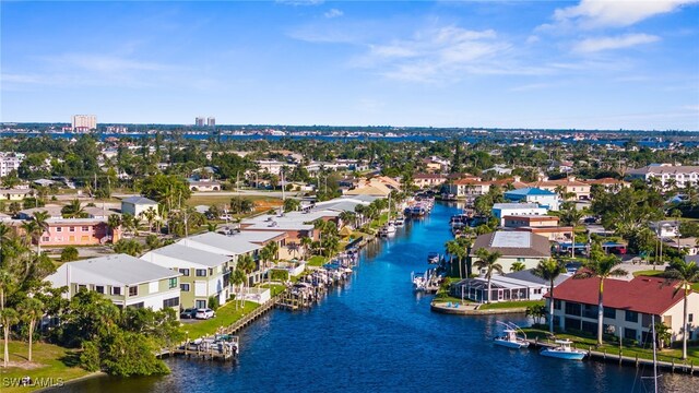 aerial view with a residential view and a water view