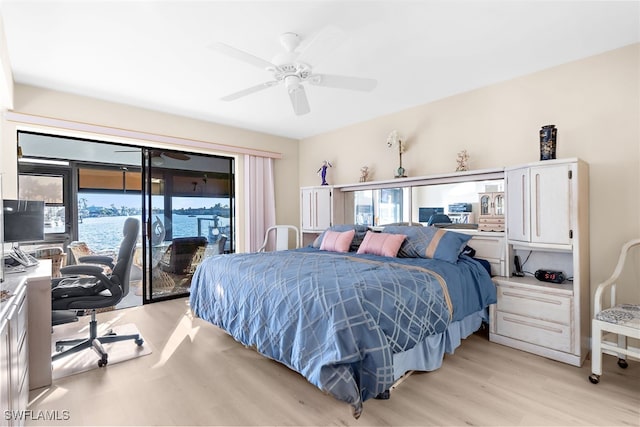 bedroom featuring access to exterior, light wood finished floors, and a ceiling fan