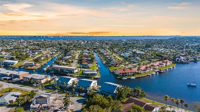 bird's eye view with a residential view and a water view