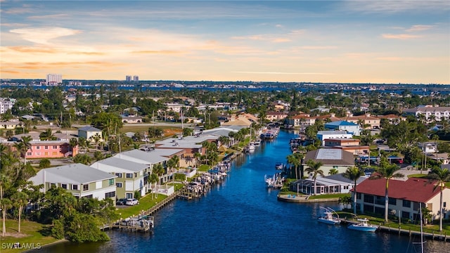 birds eye view of property featuring a residential view and a water view