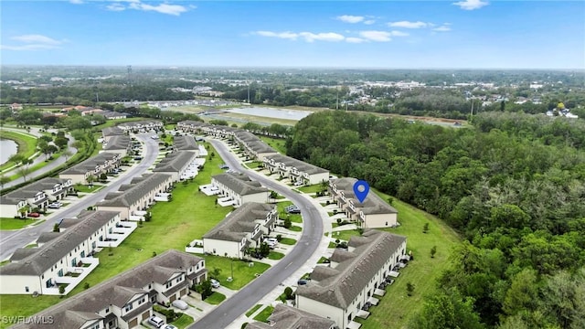 bird's eye view with a water view and a residential view