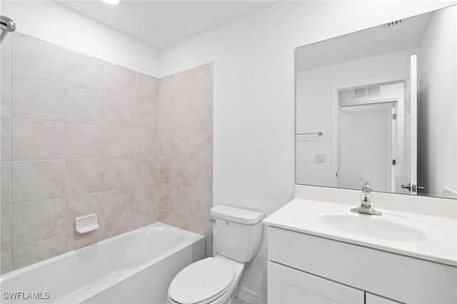 full bathroom with visible vents, toilet, vanity, and bathtub / shower combination