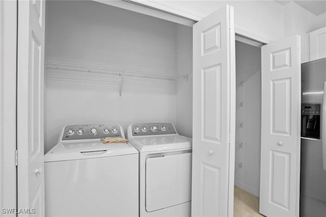 laundry room featuring laundry area and washing machine and dryer