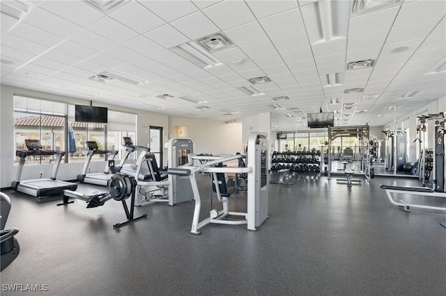 workout area featuring visible vents and a paneled ceiling