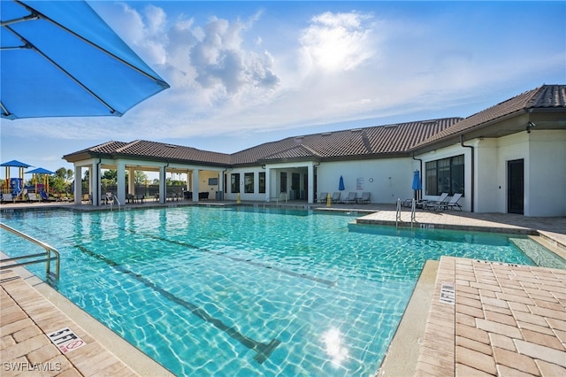 pool with a patio area