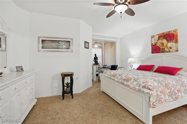 bedroom with light carpet, ceiling fan, and baseboards