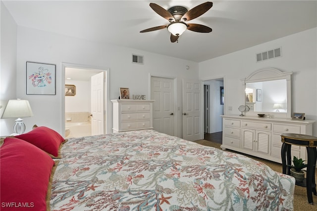 bedroom featuring visible vents, ensuite bathroom, and a ceiling fan