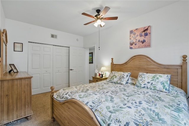 bedroom featuring carpet flooring, a ceiling fan, visible vents, and a closet